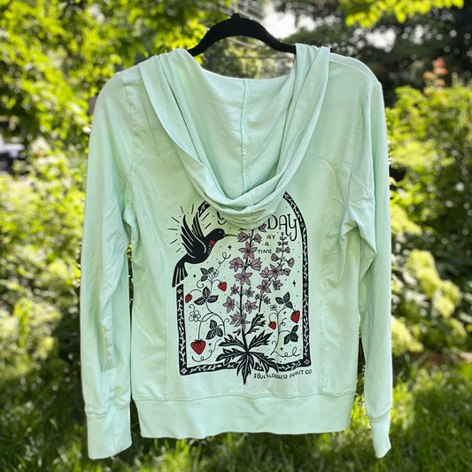 One Day at a Time | July Birth Flower | Green Zip-Up Hoodie | Medium
